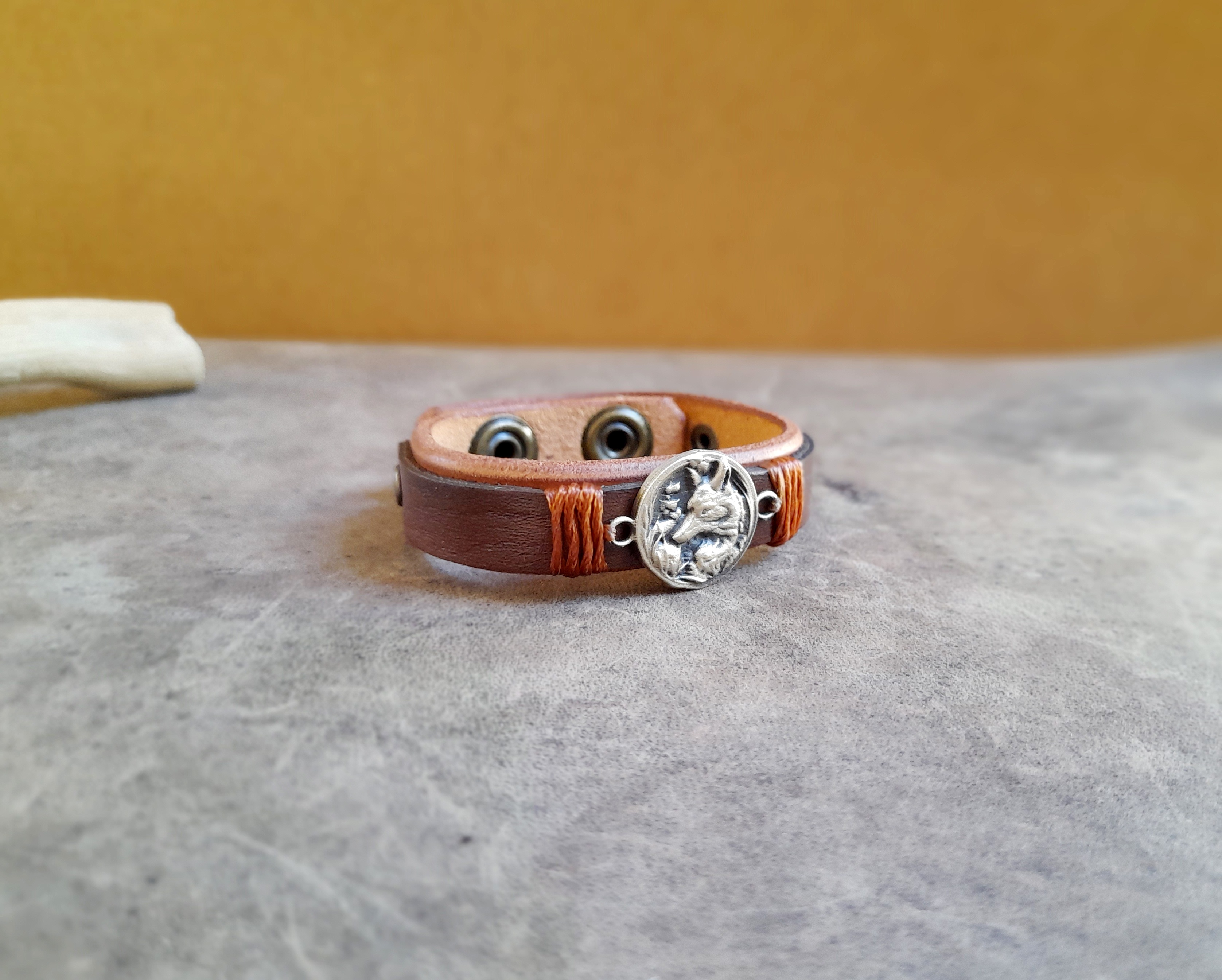 Brown Leather Cuff Bracelet for Women, featuring a handmade oxidized brass forest fox pendant.