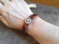 Brown Leather Cuff Bracelet for Women, featuring a handmade oxidized brass forest fox pendant.