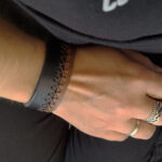 Black Brown Rugged Leather Cuff for Men with X shaped Hand Stitcing all the way around.