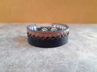 Black Brown Rugged Leather Cuff for Men with X shaped Hand Stitcing all the way around.